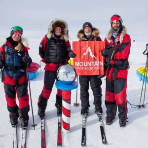 A team celebrates a Messner Start Full trip at the pole