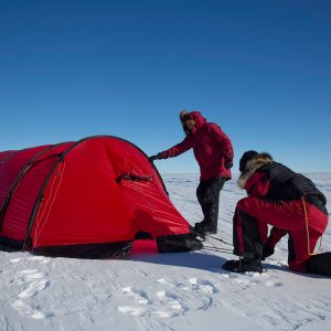 Putting up the tents at night