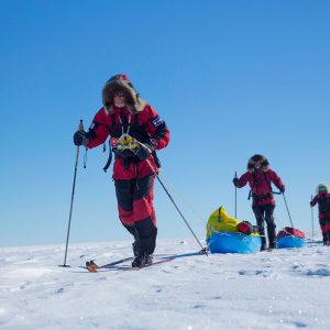 A team member navigates with the compass